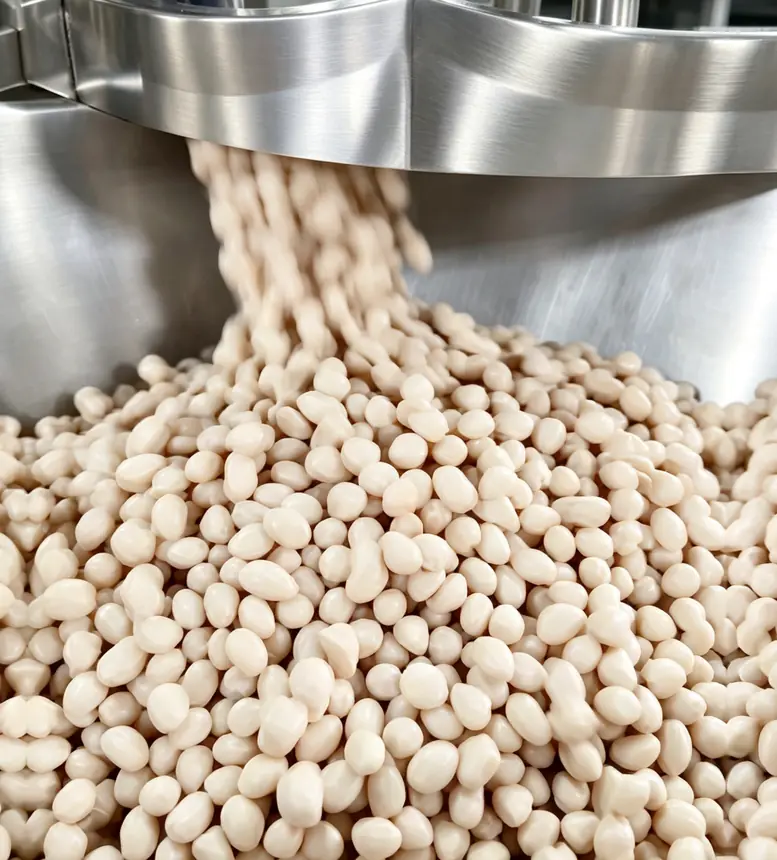 Discharge from the coating pan — Ultipower Tech nut processing machine in production